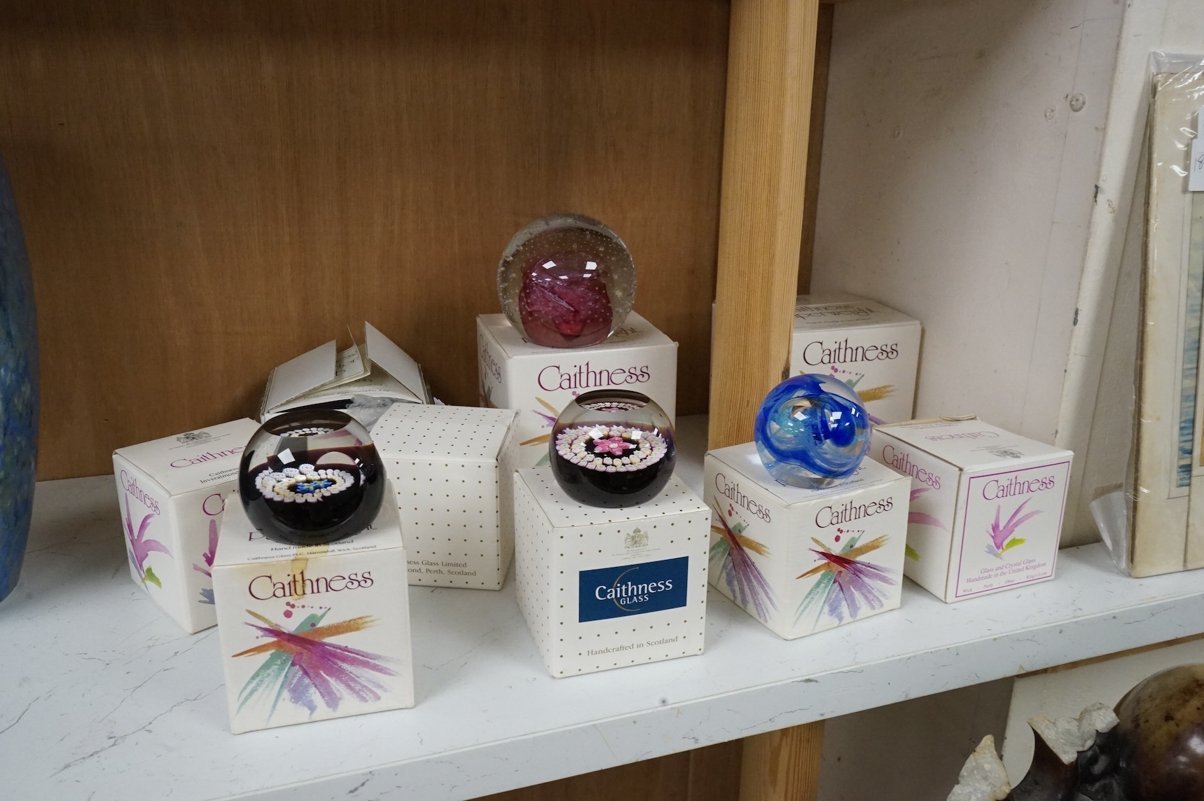 A collection of nine boxed Caithness paperweights to include Mooncrystal and miniature forget me not